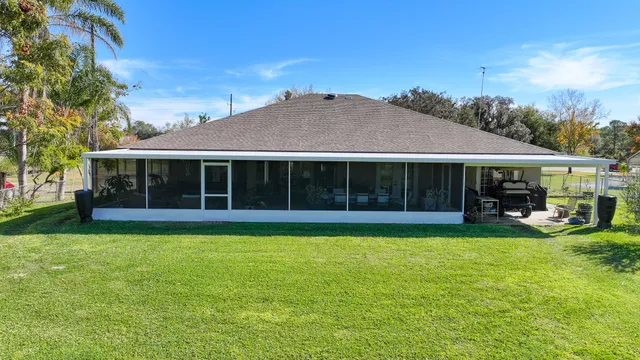 a view of a house with a yard porch and sitting area