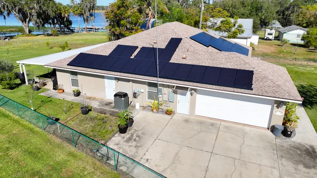 an aerial view of residential houses with outdoor space