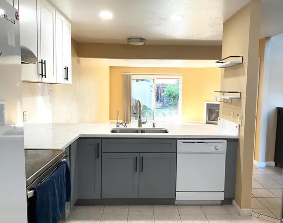 a kitchen with a sink and cabinets