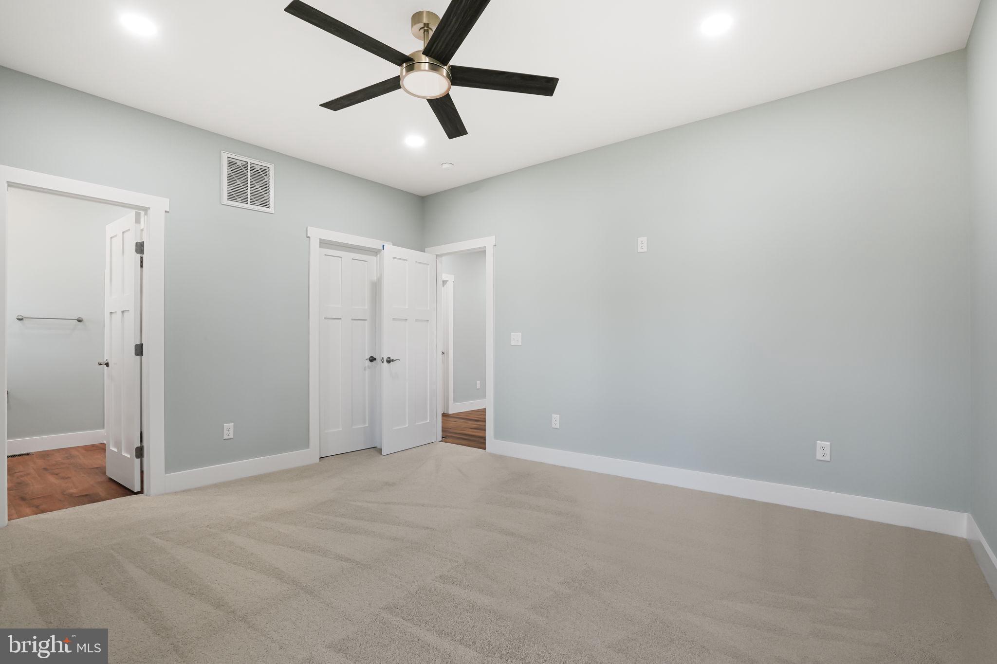 7921 East Side Road Chincoteague Island, VA 23336 - Photo 17 of 38 an empty room with closet and fan