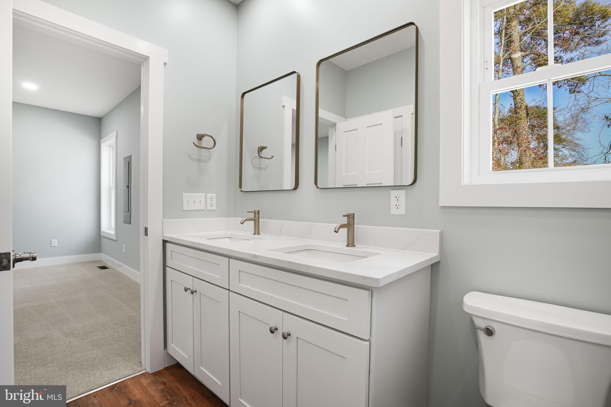 7921 East Side Road Chincoteague Island, VA 23336 - Photo 18 of 38 a bathroom with a sink and a toilet