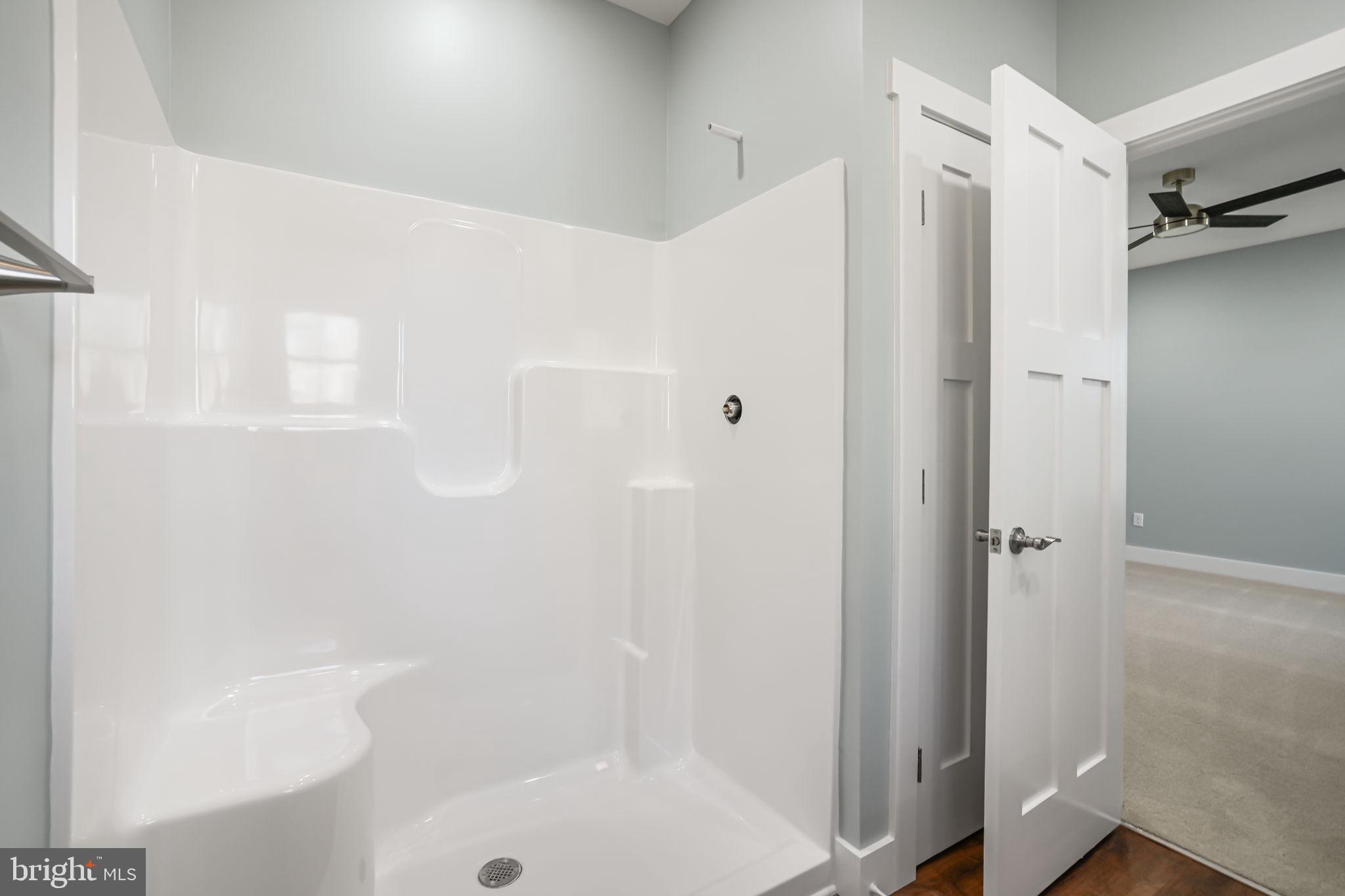 7921 East Side Road Chincoteague Island, VA 23336 - Photo 19 of 38 a bathroom with a shower