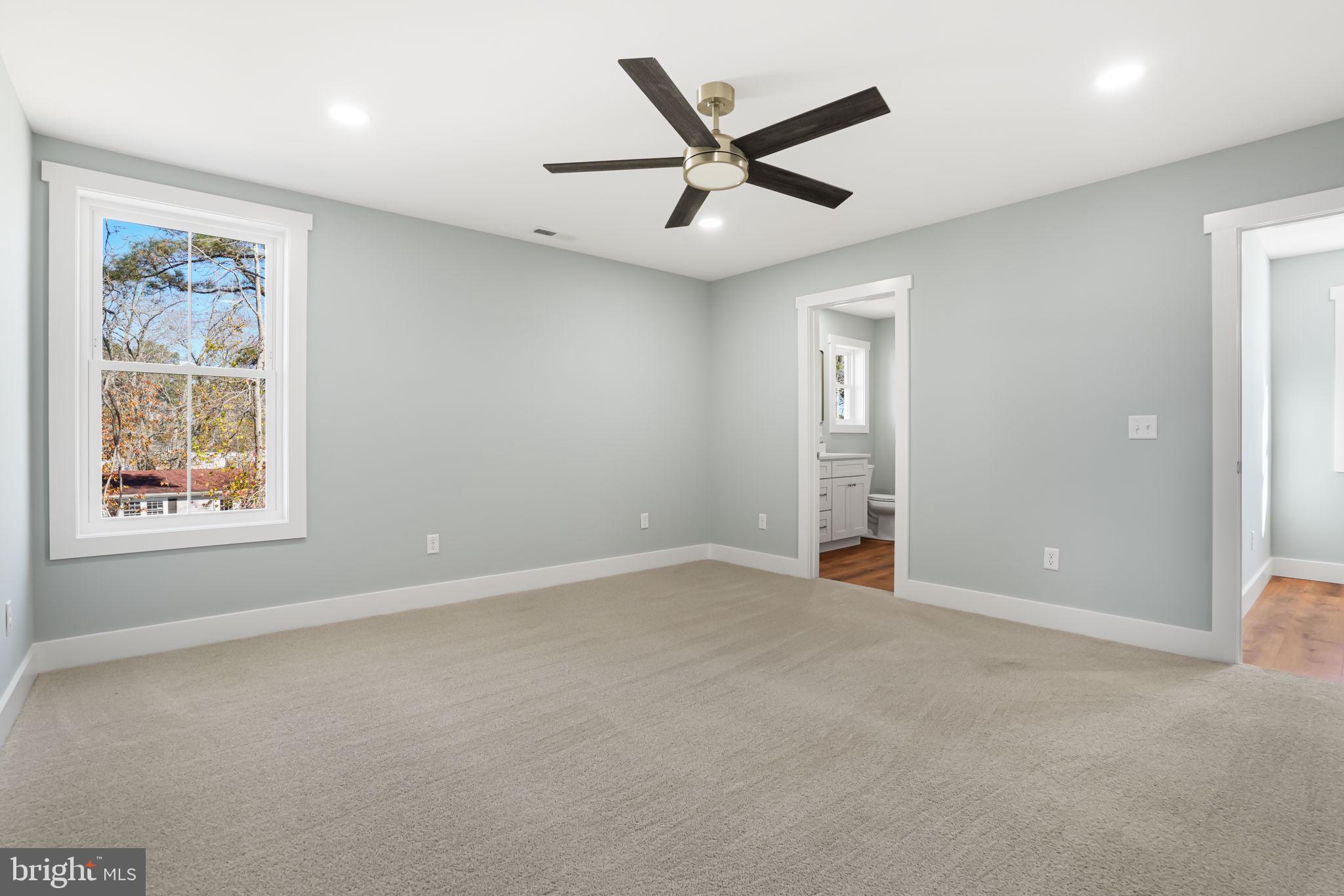 7921 East Side Road Chincoteague Island, VA 23336 - Photo 22 of 38 an empty room with closet and windows