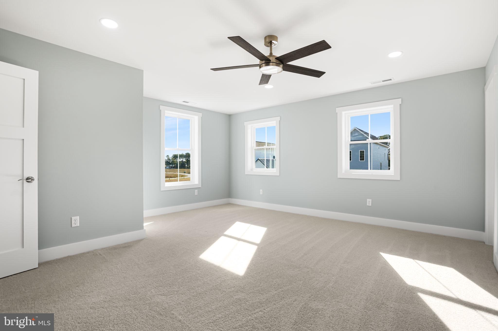 7921 East Side Road Chincoteague Island, VA 23336 - Photo 27 of 38 a view of a big room with windows and fan