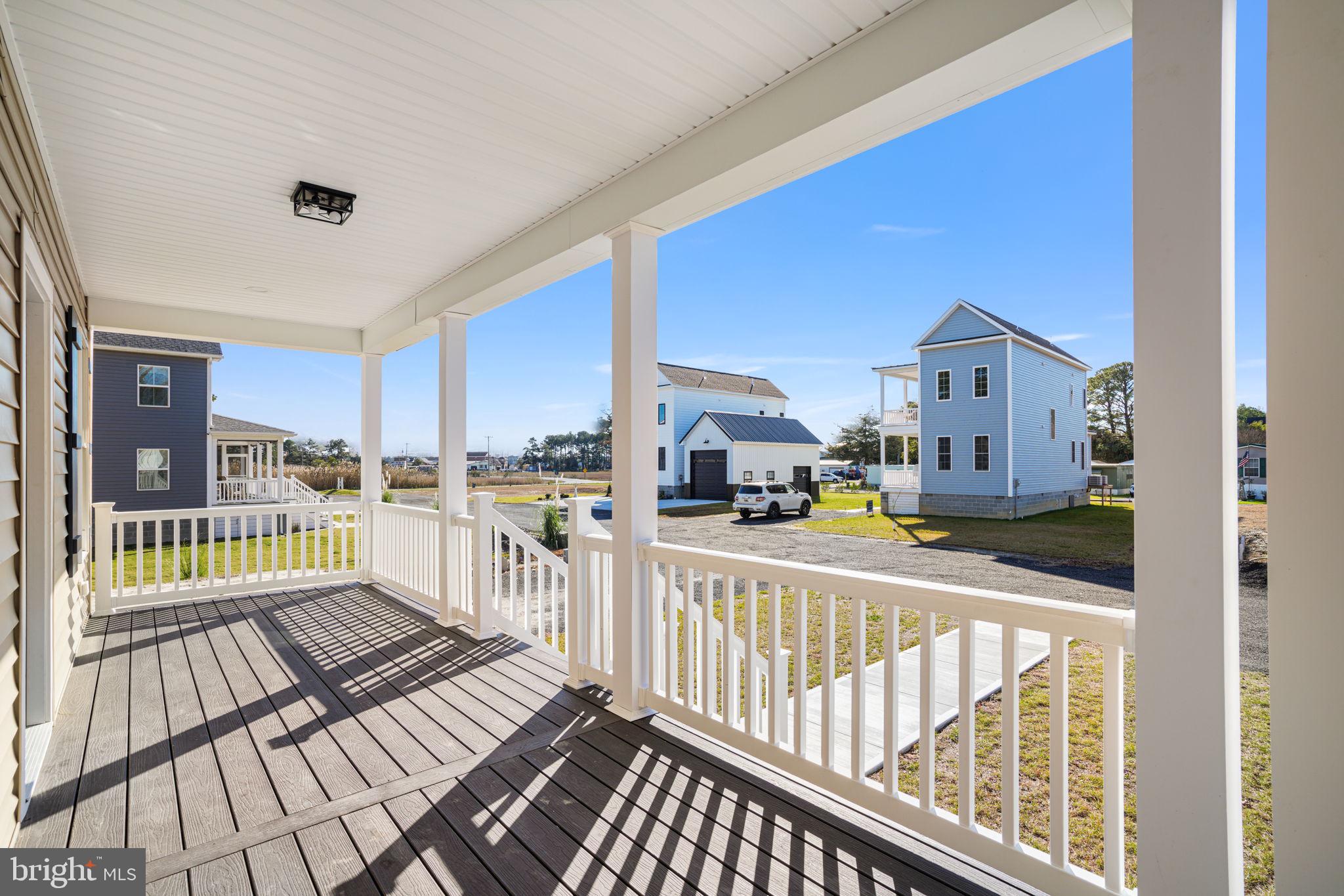 7921 East Side Road Chincoteague Island, VA 23336 - Photo 3 of 38 a view of a balcony with wooden floor