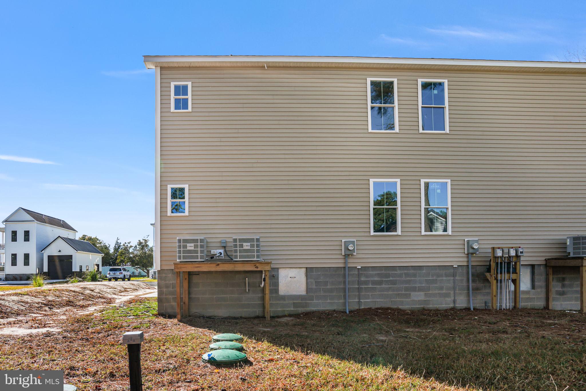 7921 East Side Road Chincoteague Island, VA 23336 - Photo 32 of 38 a view of a house with a yard
