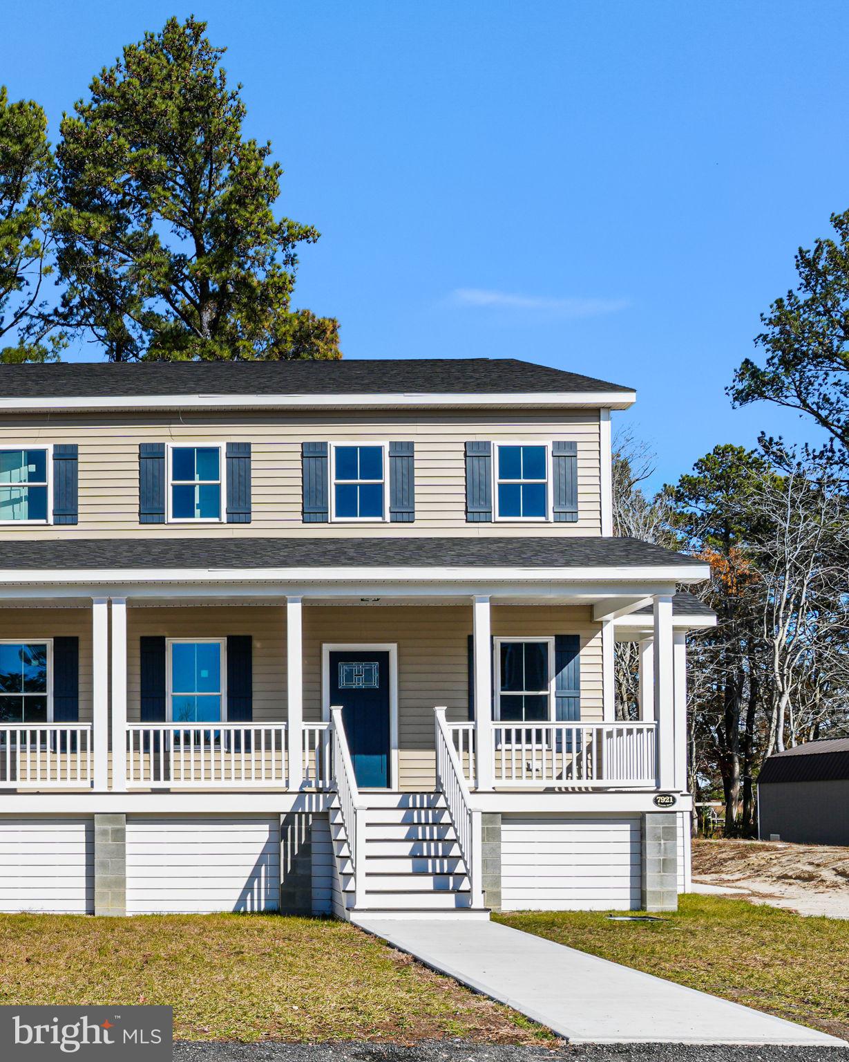 7921 East Side Road Chincoteague Island, VA 23336 - Photo 34 of 38 a front view of a house with a porch