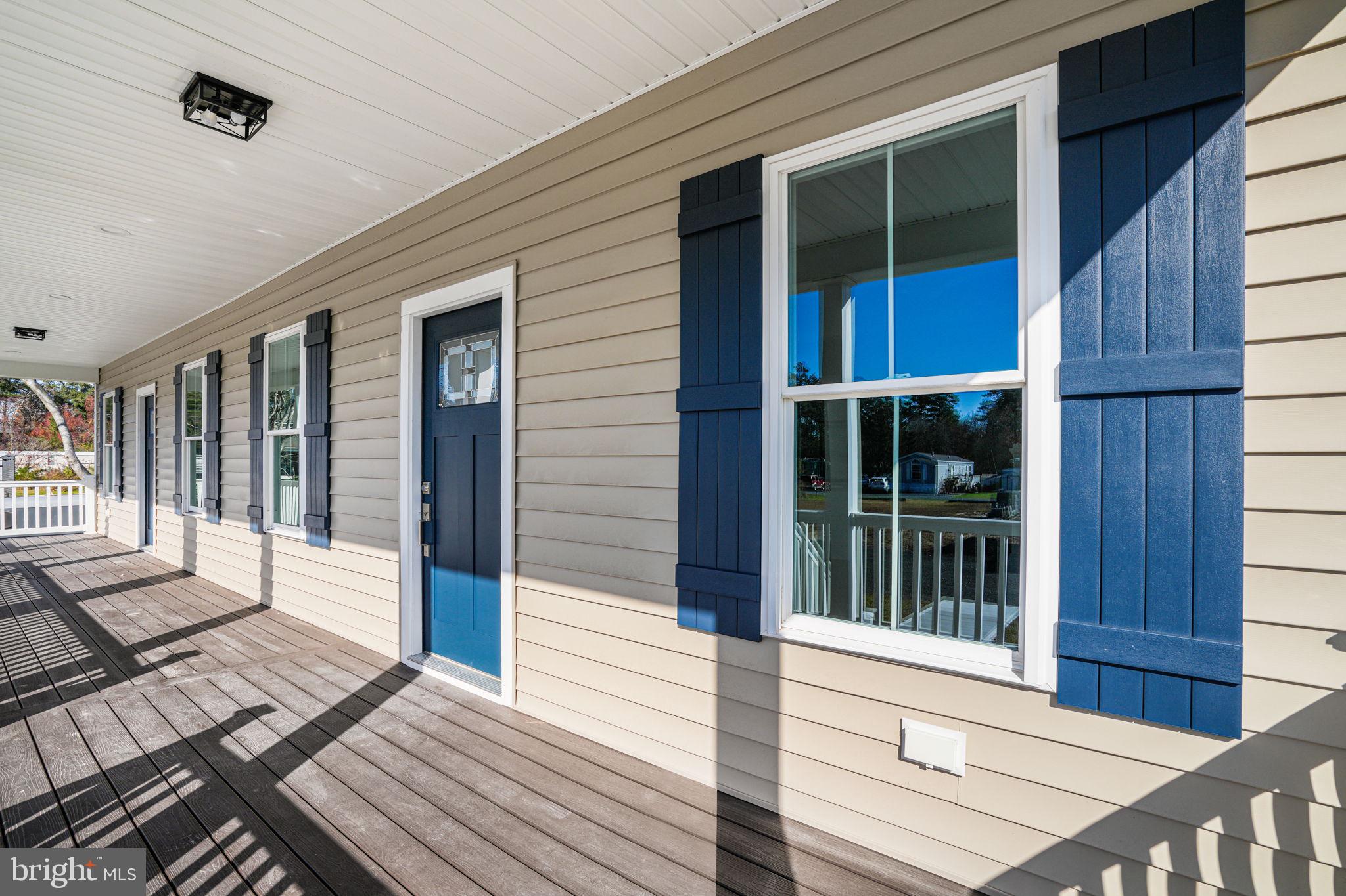 7921 East Side Road Chincoteague Island, VA 23336 - Photo 4 of 38 a view of a house with wooden floor and windows