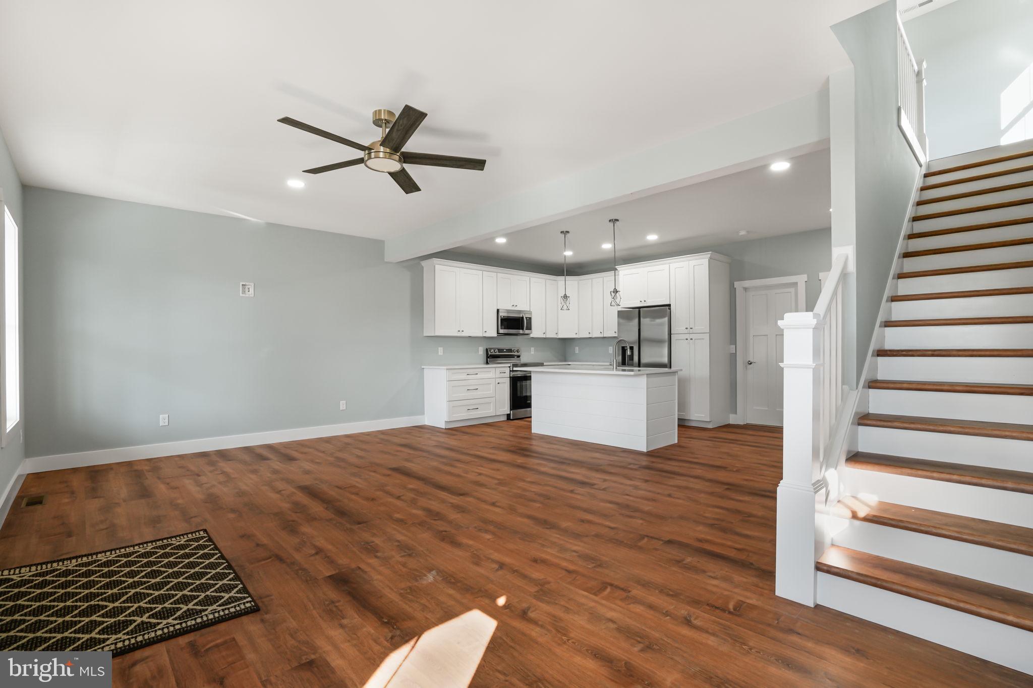 7921 East Side Road Chincoteague Island, VA 23336 - Photo 5 of 38 a view of kitchen with sink and wooden floor