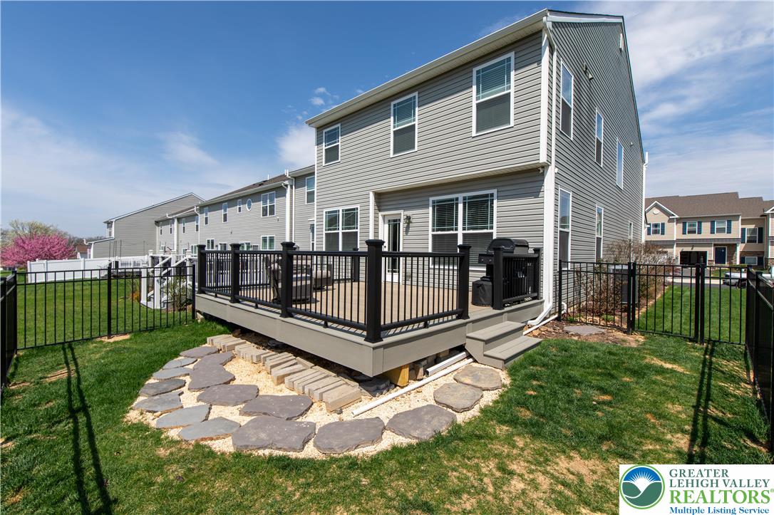 3973 Mink Road Emmaus, PA 18049 - Photo 5 of 45 a view of a house with a yard and a wooden deck