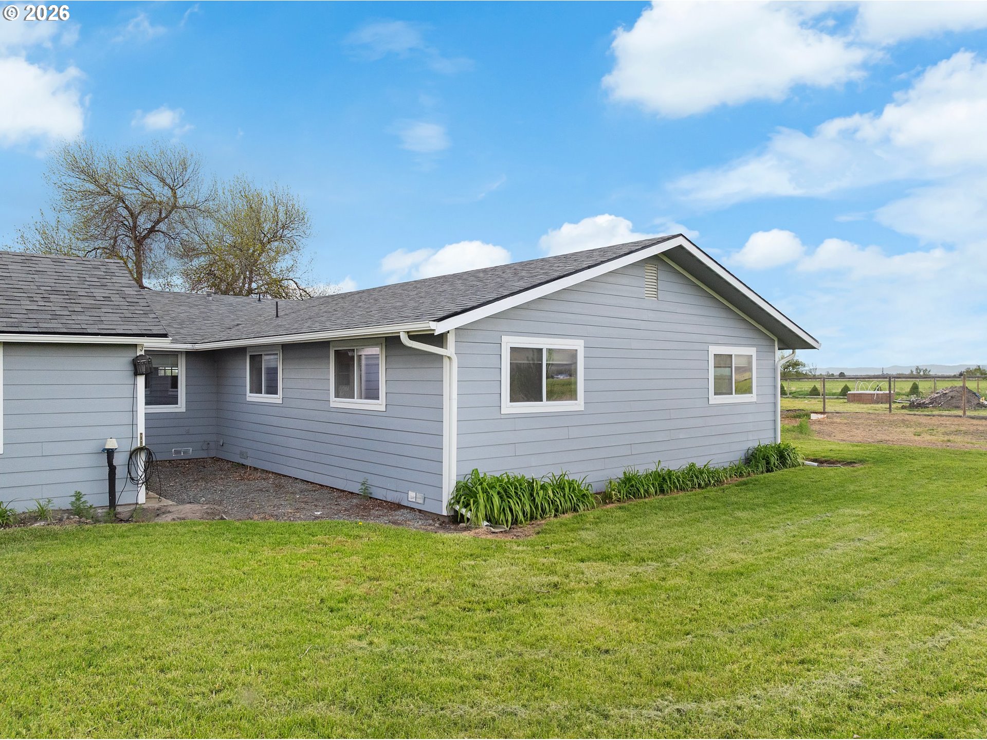 58015 Godley Road Union, OR 97883 - Photo 26 of 44 a backyard of a house with lots of green space
