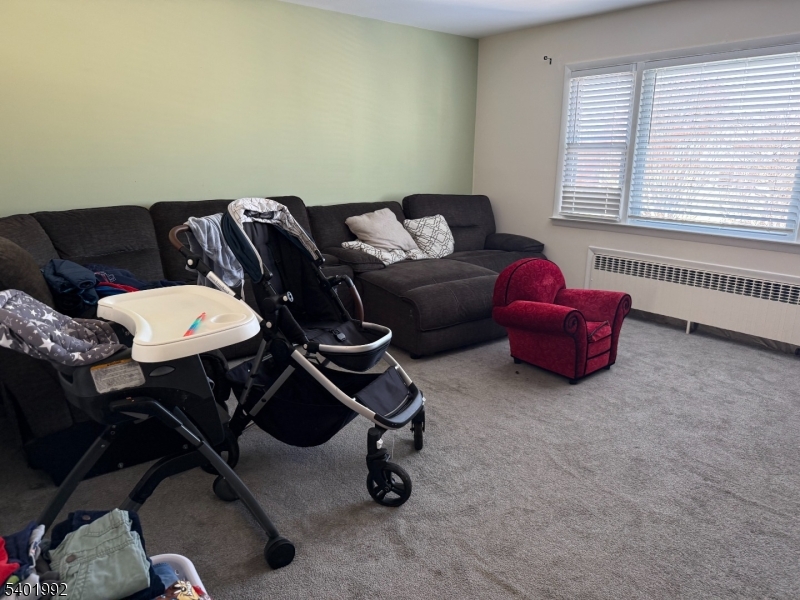 6 Underhill Court, Unit 2 Nutley, NJ 07110 - Photo 4 of 11 a living room with furniture and a window