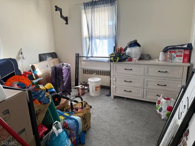 a bed room with a bed and a window