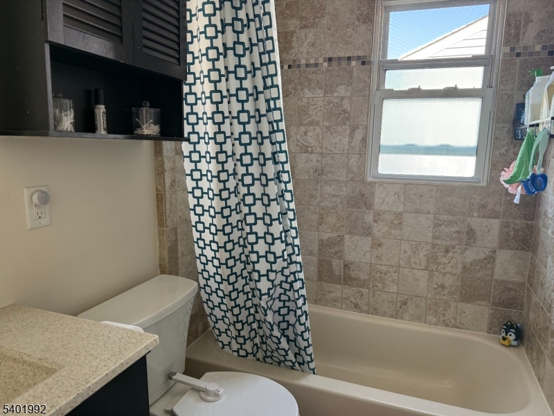 6 Underhill Court, Unit 2 Nutley, NJ 07110 - Photo 8 of 11 a bathroom with a bathtub and a shower