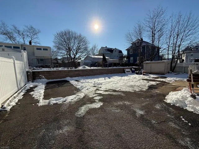 a view of a back yard of the house
