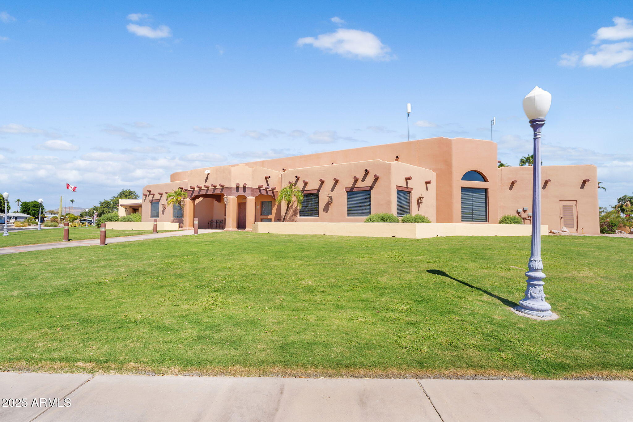 8865 East Baseline Road, Unit 802 Mesa, AZ 85209 - Photo 33 of 44 a view of a building with a big yard