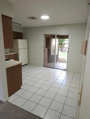 a view of a kitchen with furniture and a window