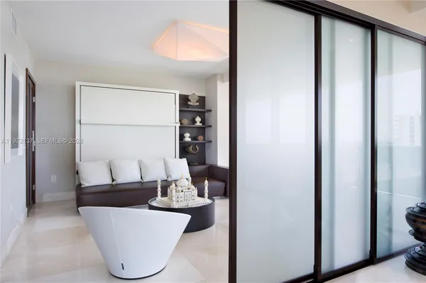 a living room with furniture and a window