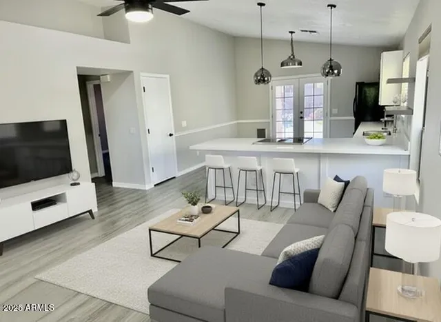 a living room with furniture and a flat screen tv