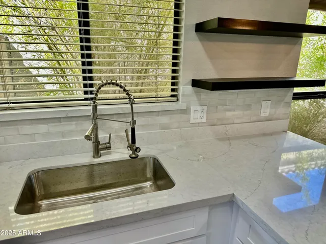 a kitchen with a sink and a window
