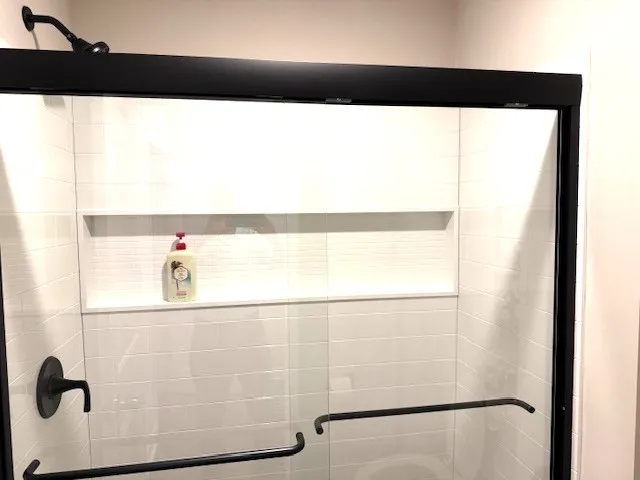a picture of a bathroom with a shower