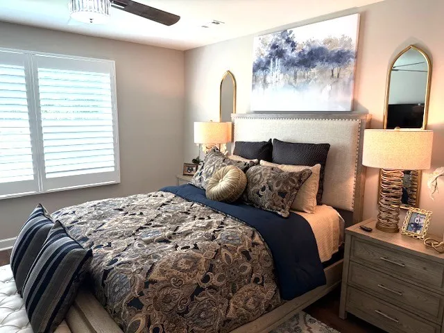 a bedroom with a bed and lamp