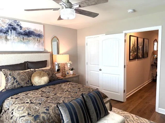 a bedroom with a bed and window