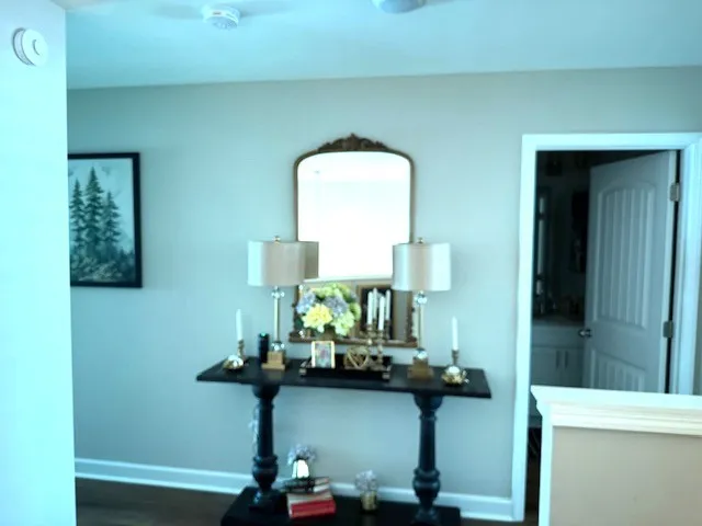 a view of entryway with livingroom and chandelier