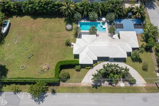 an aerial view of a house with outdoor space