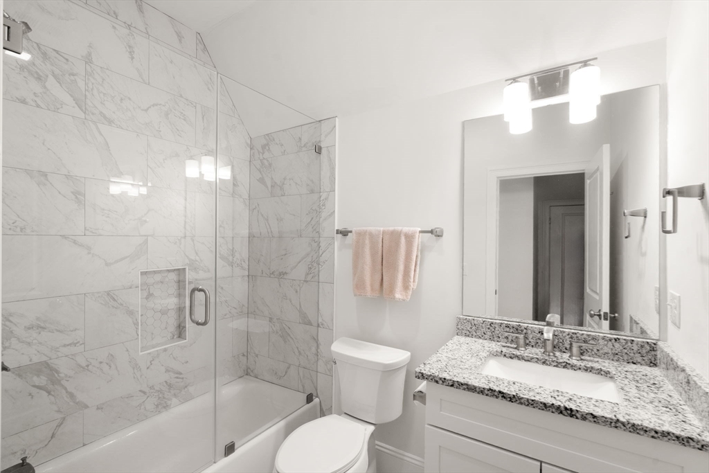 68 Chestnut Street, Unit 6 Newton, MA 02465 - Photo 16 of 22 a bathroom with a granite countertop sink toilet and shower