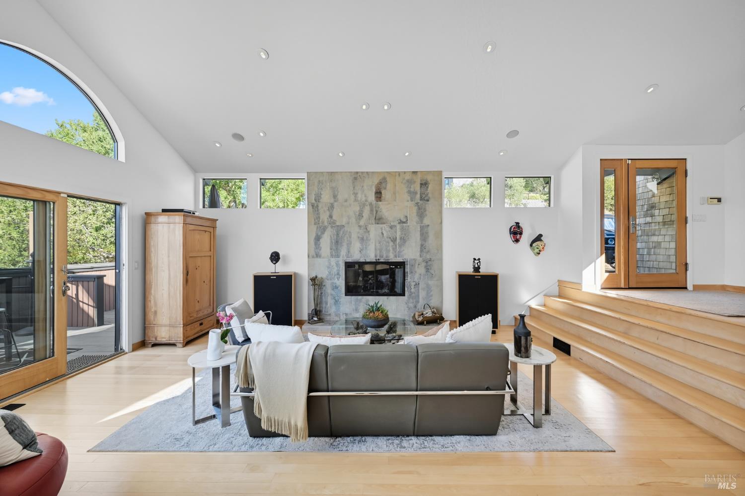 103 Holstein Road San Anselmo, CA 94960 - Photo 11 of 66 a living room with furniture a fireplace and a flat screen tv