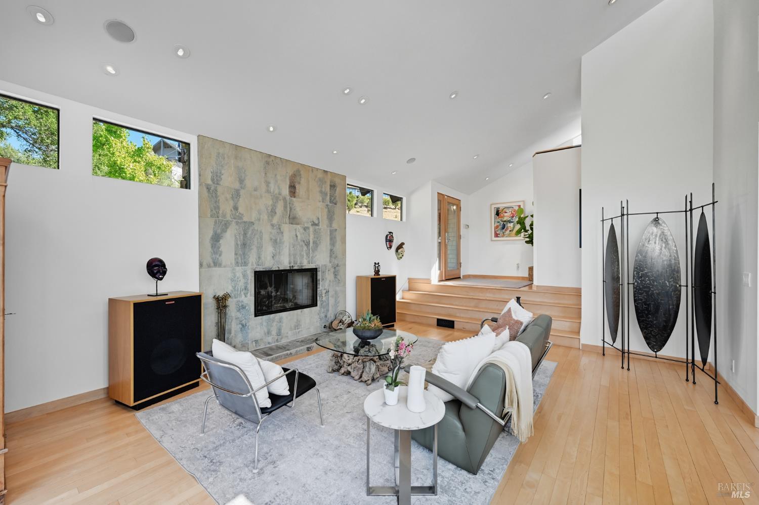 103 Holstein Road San Anselmo, CA 94960 - Photo 12 of 66 a living room with furniture a fireplace and a flat screen tv