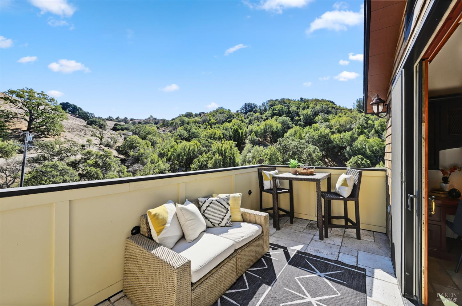 103 Holstein Road San Anselmo, CA 94960 - Photo 23 of 66 a balcony with table and chairs