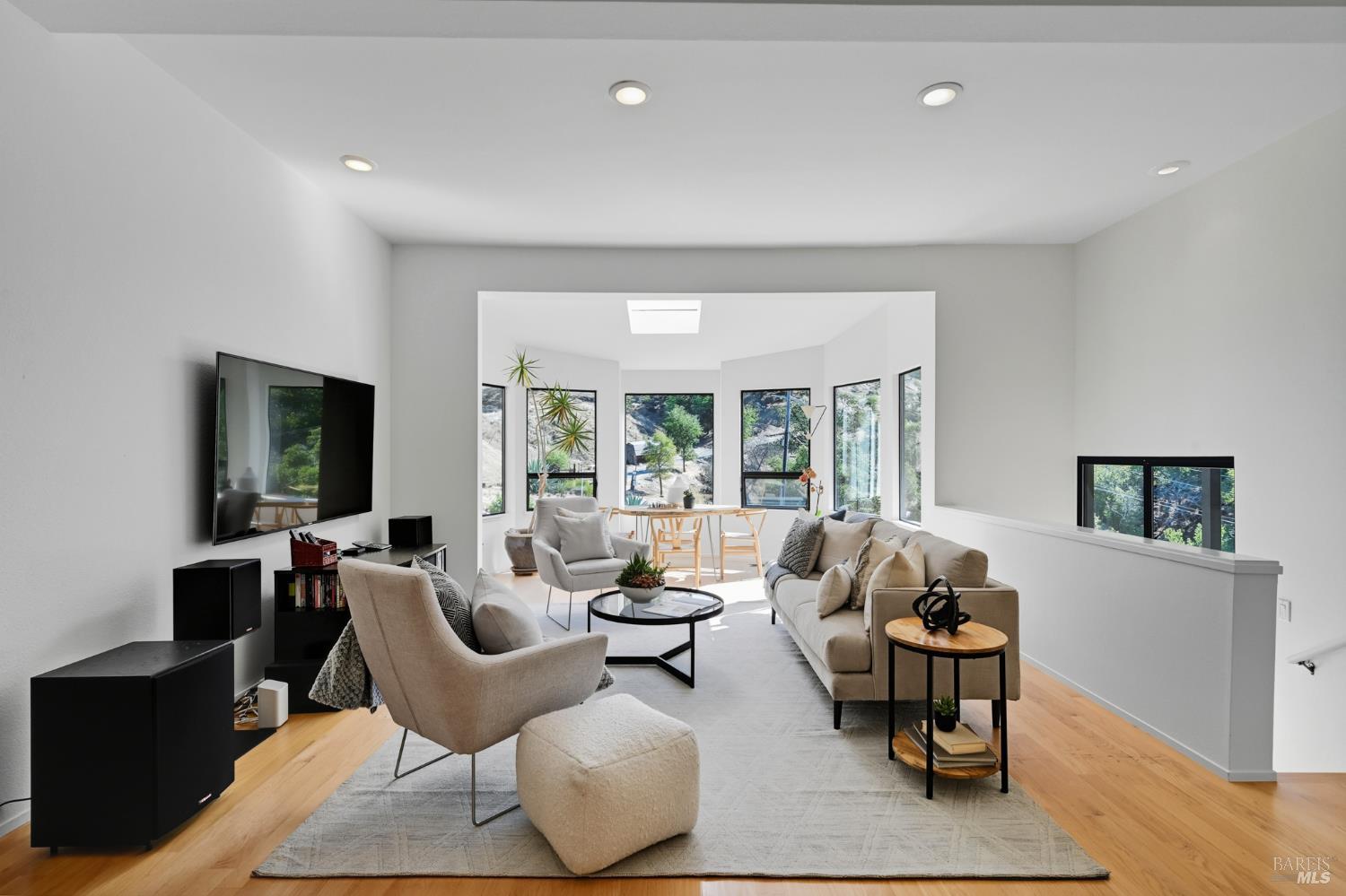 103 Holstein Road San Anselmo, CA 94960 - Photo 29 of 66 a living room with furniture and large windows