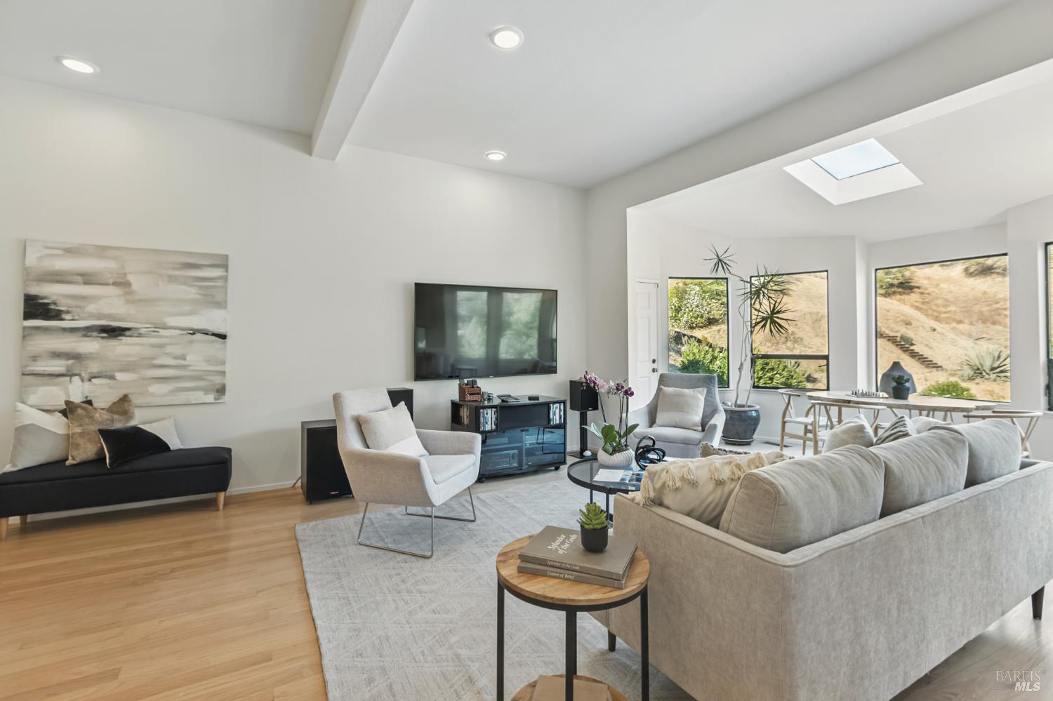 103 Holstein Road San Anselmo, CA 94960 - Photo 33 of 66 a living room with furniture and a flat screen tv