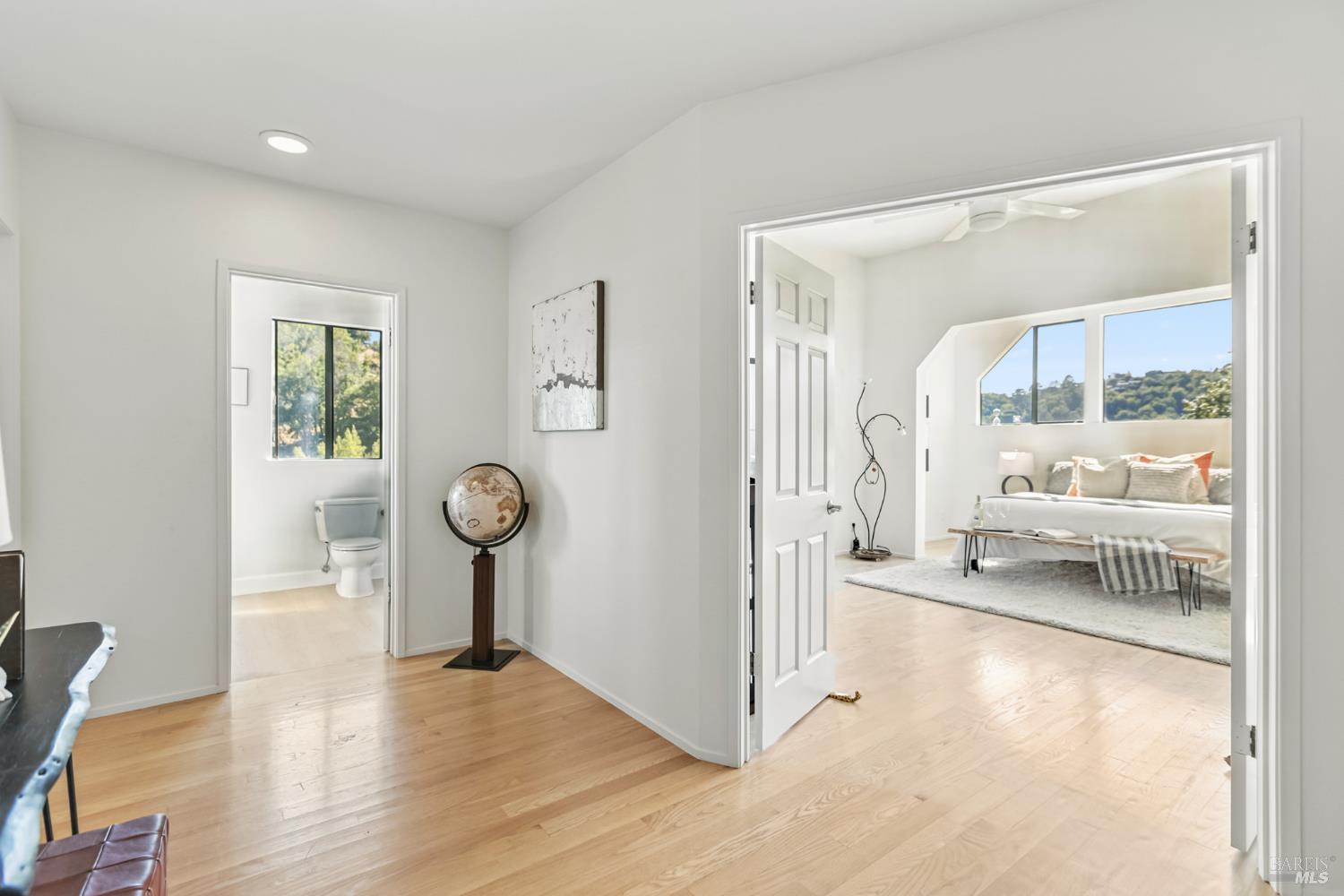 103 Holstein Road San Anselmo, CA 94960 - Photo 36 of 66 a living room with kitchen view and a wooden floor