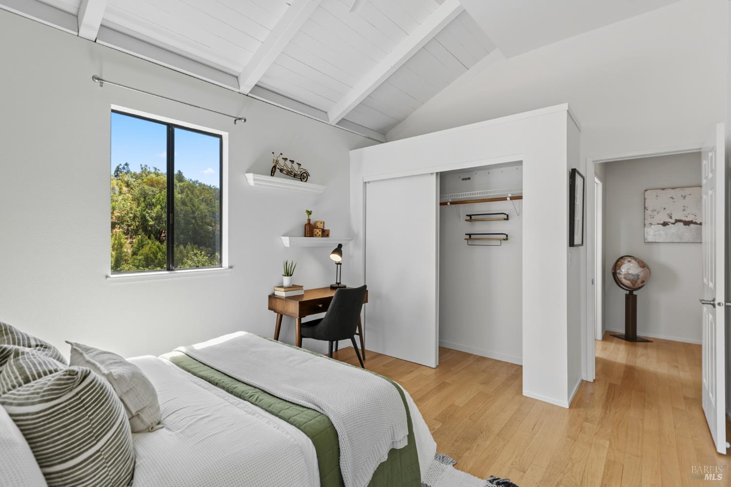 103 Holstein Road San Anselmo, CA 94960 - Photo 48 of 66 a bedroom with a bed and wooden floor