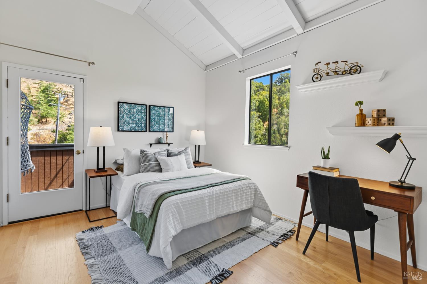 103 Holstein Road San Anselmo, CA 94960 - Photo 49 of 66 a bedroom with a bed and wooden floor