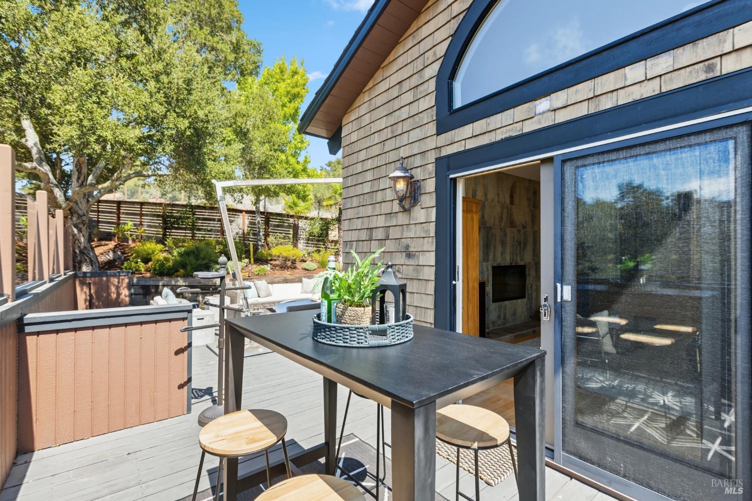103 Holstein Road San Anselmo, CA 94960 - Photo 10 of 66 a view of a patio with table and chairs and potted plants