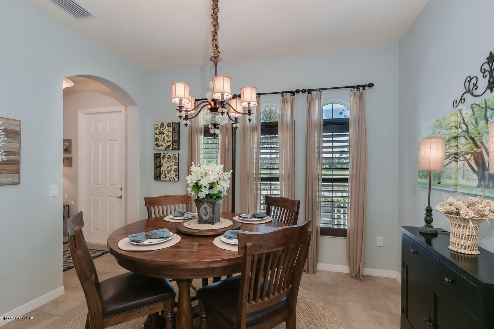 3225 Sedge Drive Rockledge, FL 32955 - Photo 11 of 35 a view of a dining room with furniture window and outside view