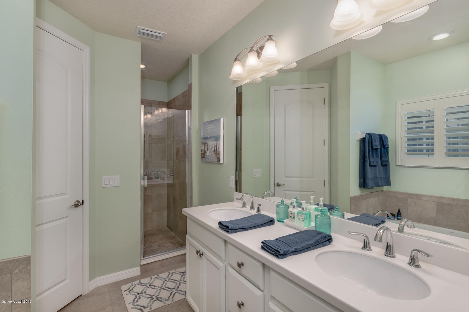 3225 Sedge Drive Rockledge, FL 32955 - Photo 19 of 35 a bathroom with a sink and a mirror
