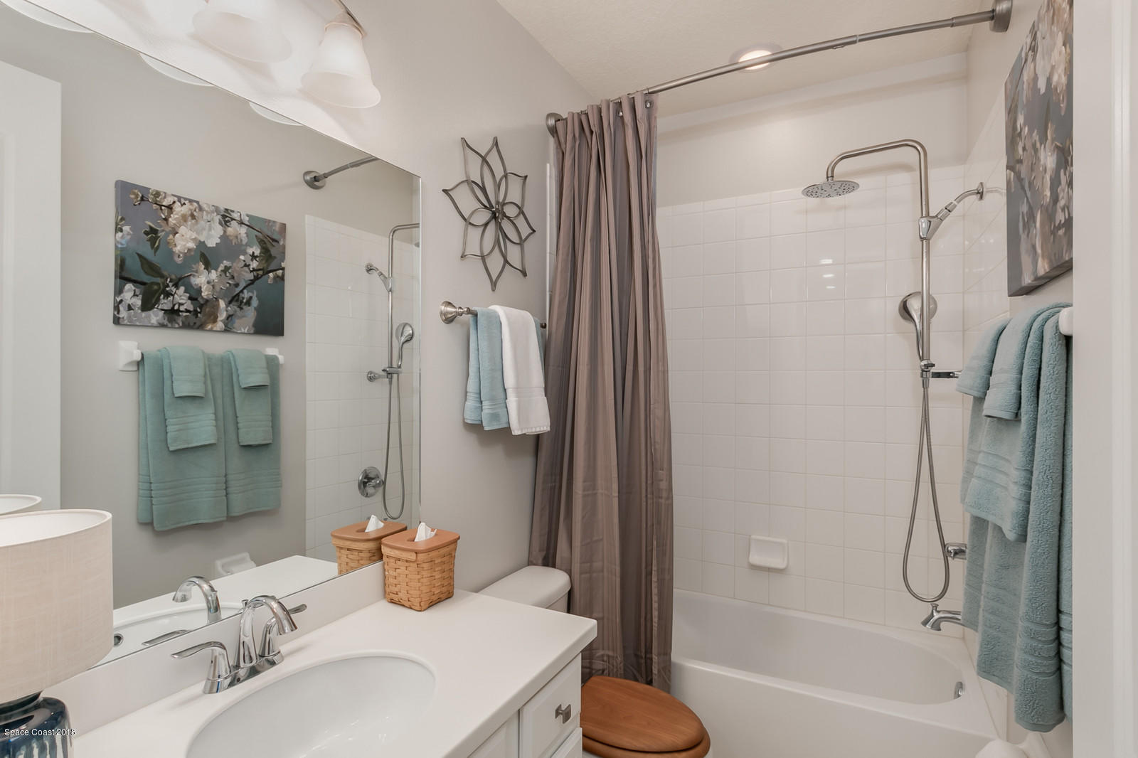 3225 Sedge Drive Rockledge, FL 32955 - Photo 24 of 35 a bathroom with a sink toilet and shower