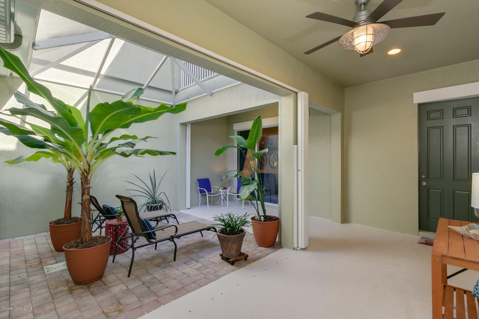 3225 Sedge Drive Rockledge, FL 32955 - Photo 29 of 35 a living room with furniture and a potted plant