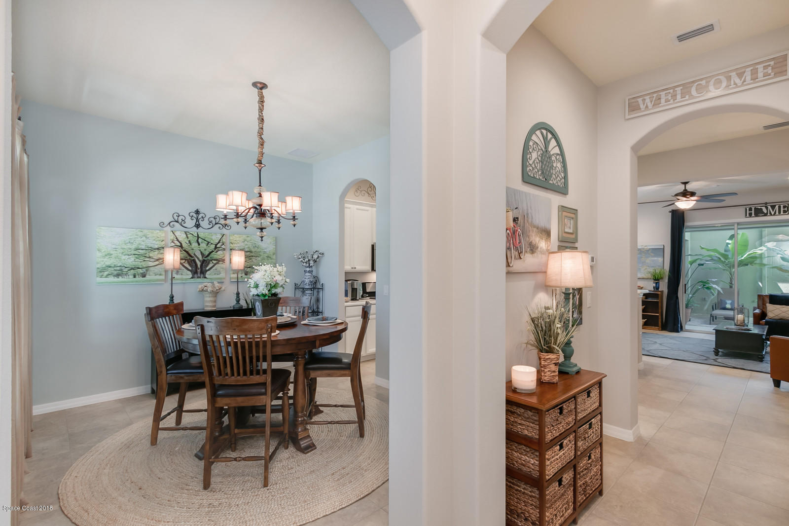 3225 Sedge Drive Rockledge, FL 32955 - Photo 4 of 35 a view of a dining room with furniture and chandelier