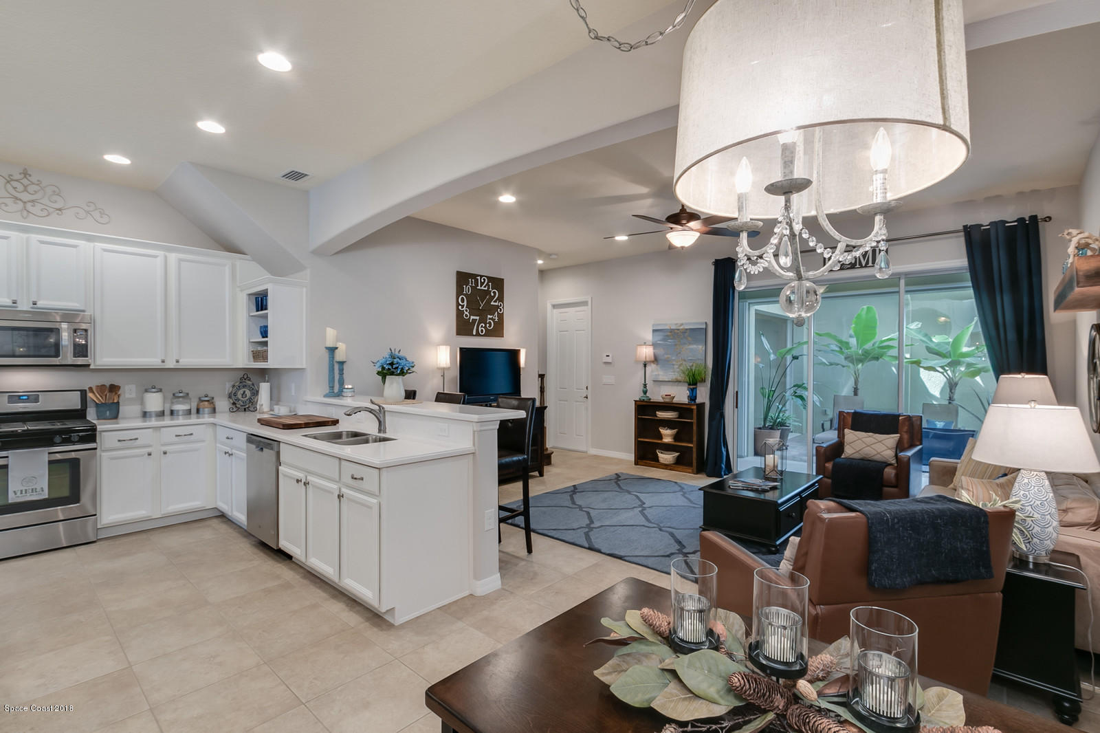 3225 Sedge Drive Rockledge, FL 32955 - Photo 6 of 35 a large white kitchen with lots of counter space and breakfast area