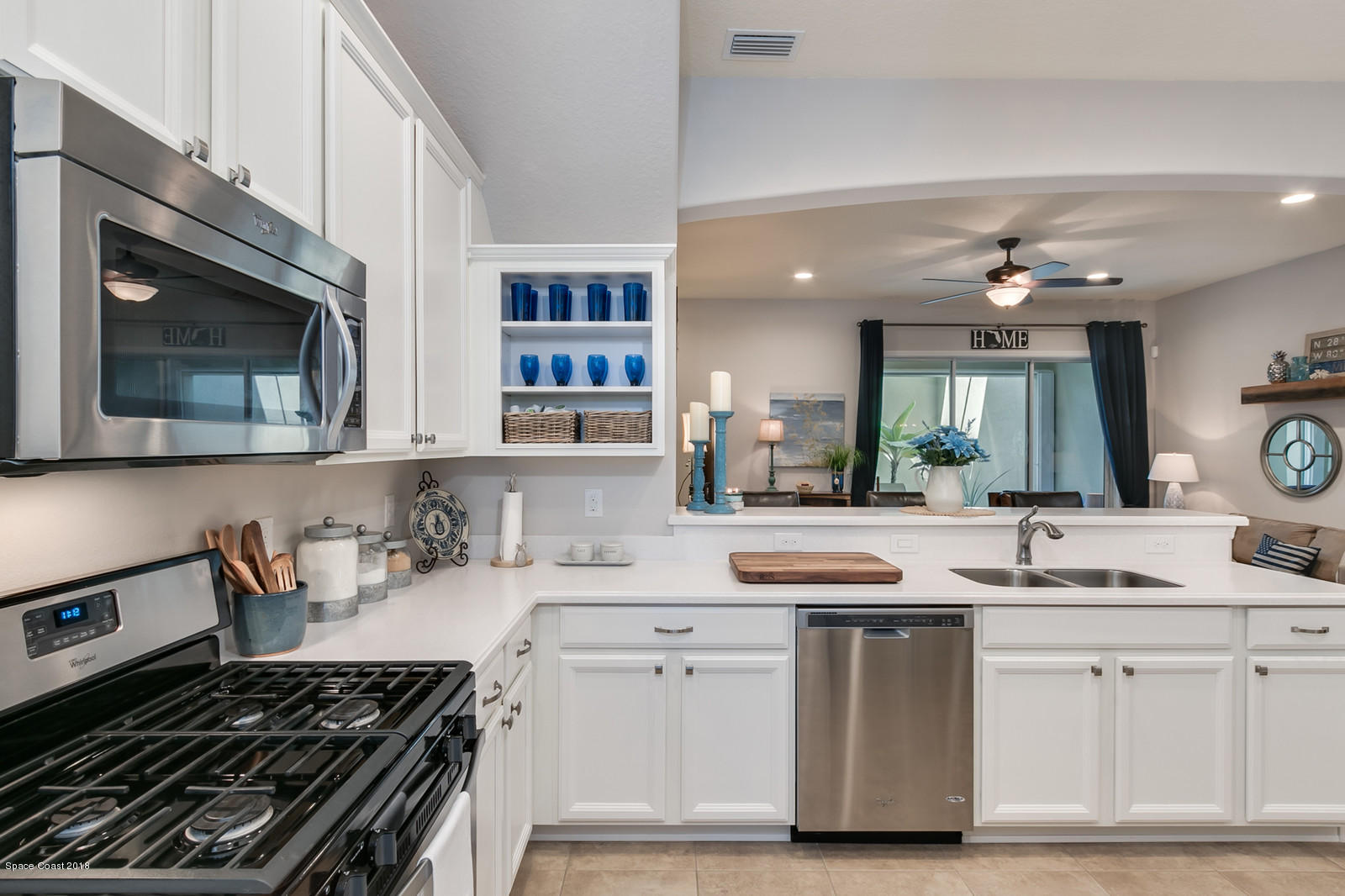 3225 Sedge Drive Rockledge, FL 32955 - Photo 7 of 35 a kitchen with cabinets appliances and a stove