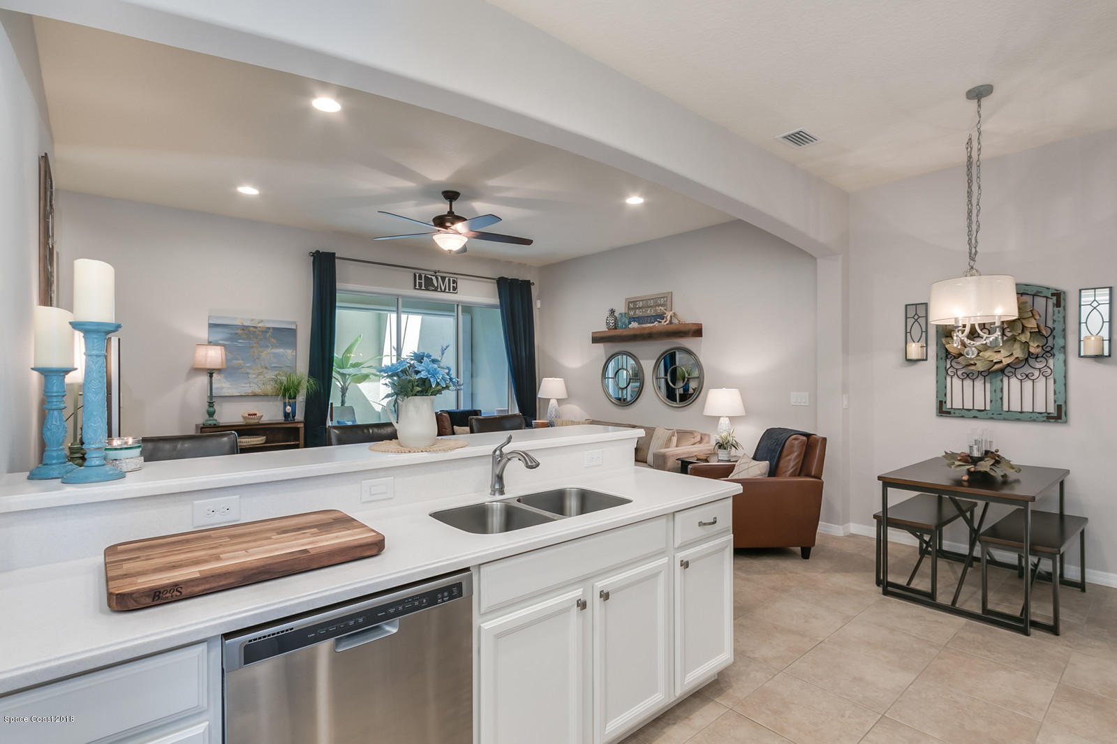 3225 Sedge Drive Rockledge, FL 32955 - Photo 10 of 35 a kitchen with furniture and a chandelier