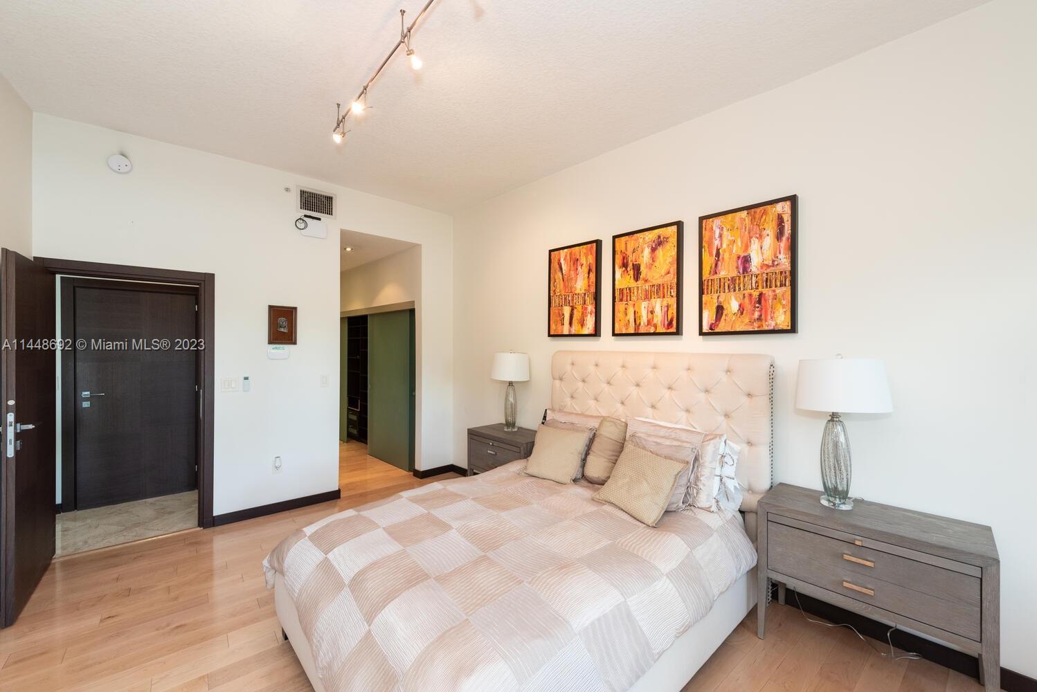 2401 Anderson Road, Unit 3 Coral Gables, FL 33134 - Photo 16 of 46 a bedroom with a bed and a painting