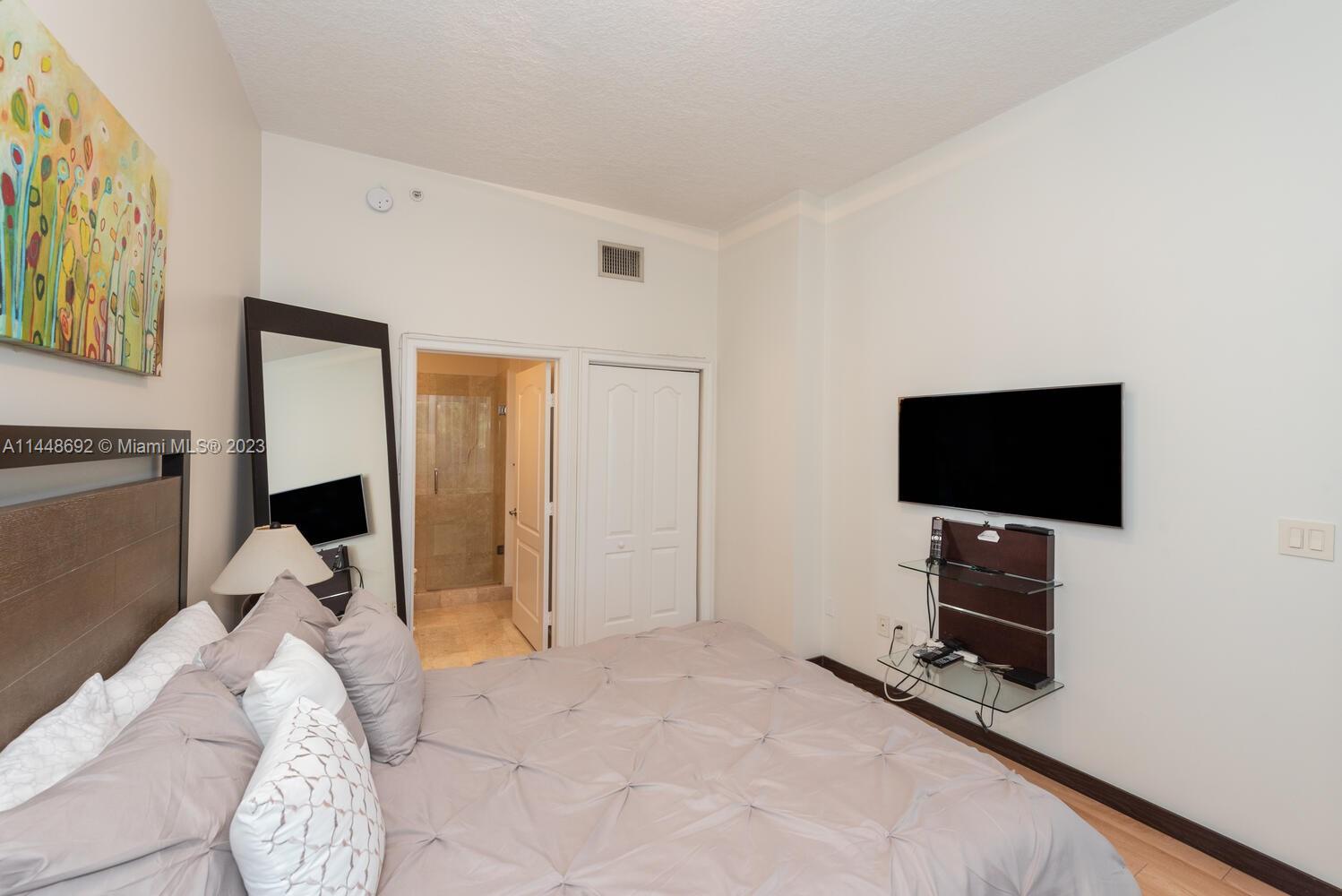 2401 Anderson Road, Unit 3 Coral Gables, FL 33134 - Photo 23 of 46 a view of a livingroom with furniture and a flat screen tv