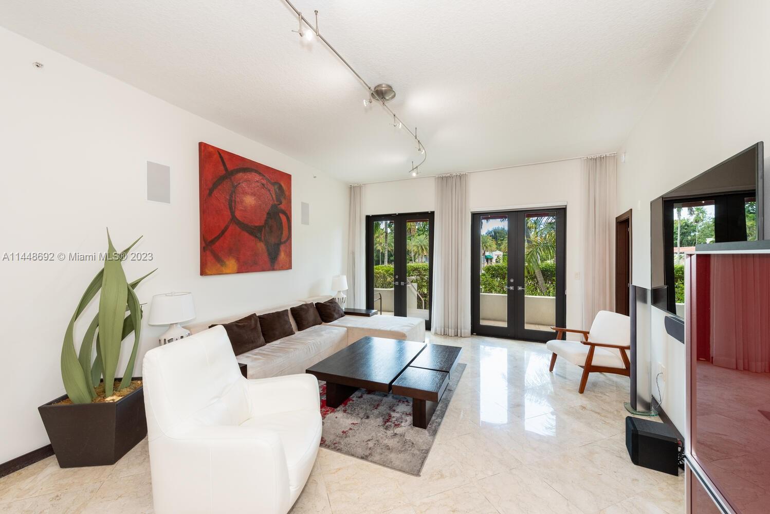2401 Anderson Road, Unit 3 Coral Gables, FL 33134 - Photo 3 of 46 a living room with furniture flowerpot and a window